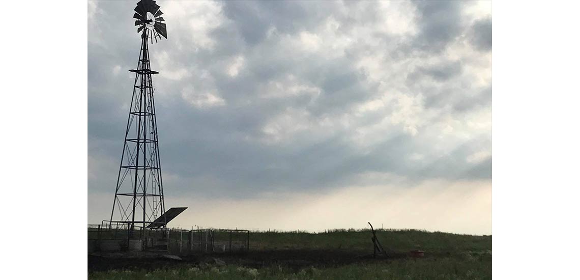 A scenic picture of an old windmill in our pasture.